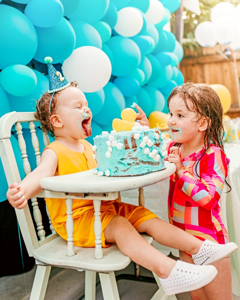 Brother and sister sharing cake. Birthday Party