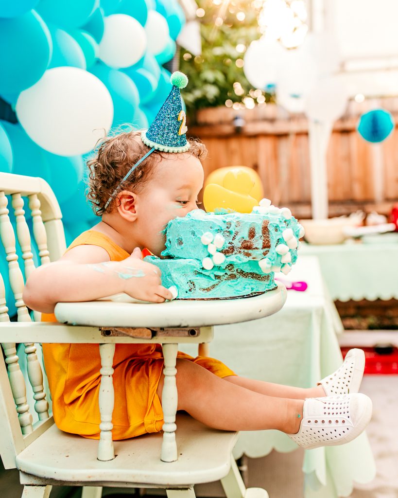 Two Year old eating Birthday Cake