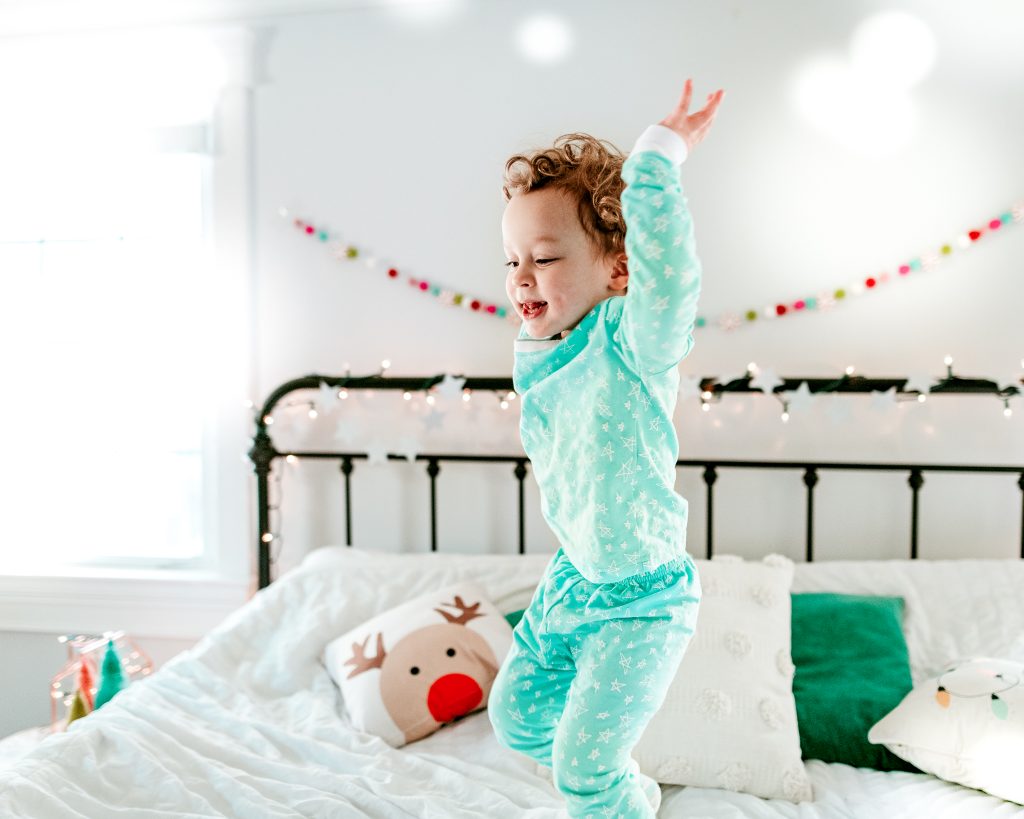 Jumping on bed in holiday jammies
