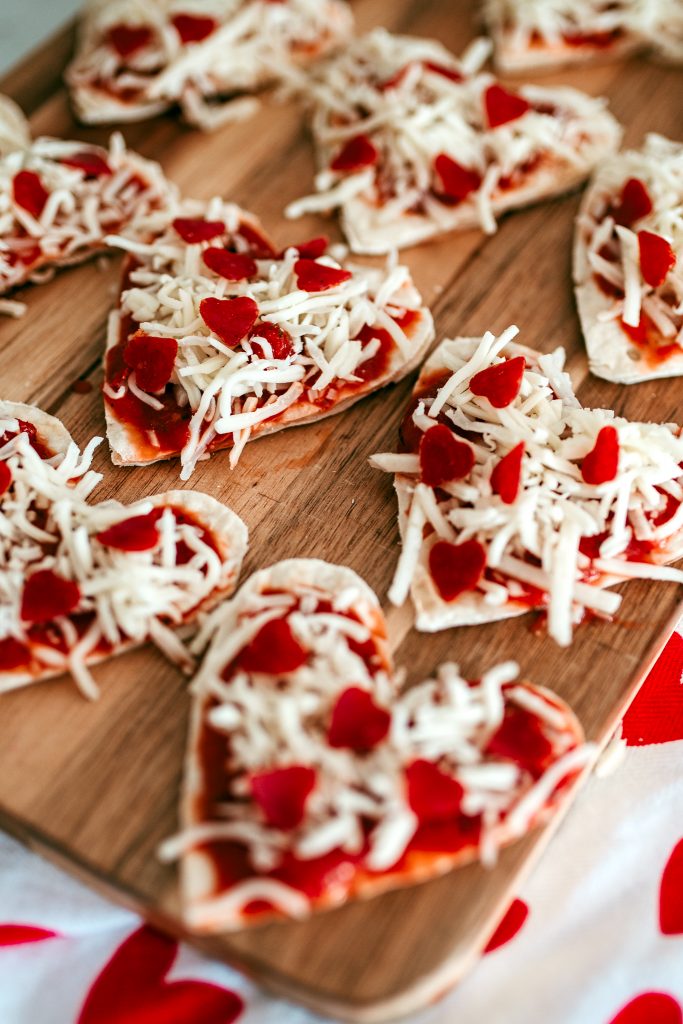 Make these mini pepperoni pizza hearts! Add a toppings bar for a fun family dinner date idea!