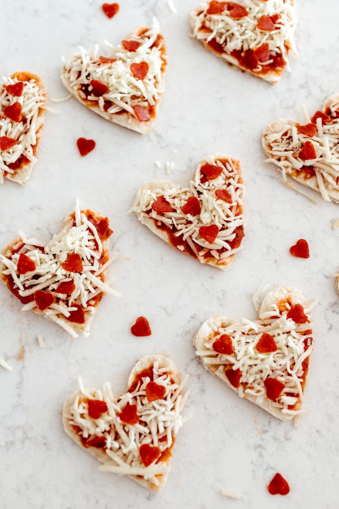 Pizza hearts with tiny pepperoni heart toppings. Easy Valentine's Day dinner for the family