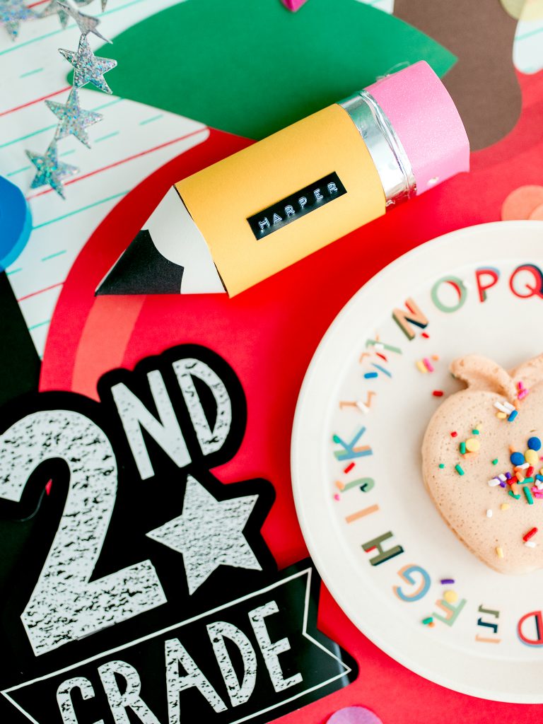 Back to school party table setting. DIY toilet paper roll pencil and an apple waffle on an alphabet plate.