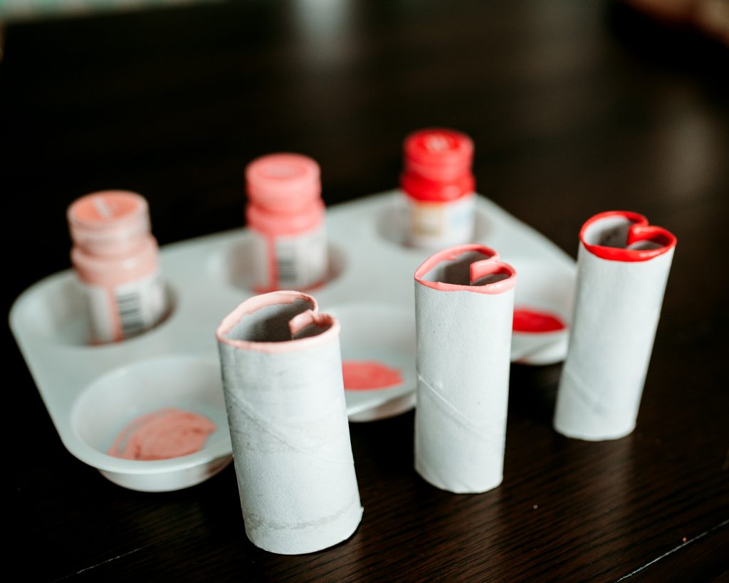 A simple and budget friendly Valentine craft using paper rolls to make heart stamps 