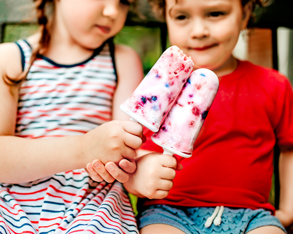 Cheers to yummy fruit and yogurt popsicles! Red, White and blue kid-friendly treat recipe! Healthy, delicious and easy!