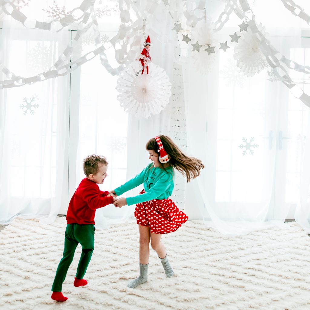 Dancing in a DIY winter wonderland! How to make your own snowflake ceiling for an indoor snow day!