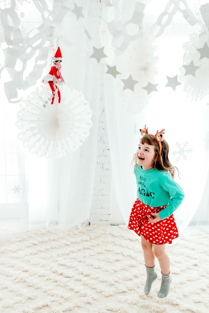 A stunning Elf on the Shelf arrival using paper chains to make a snowy indoor winter wonderland