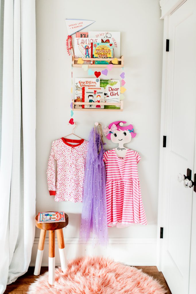 Bookshelves decorated for Valentine's Day. Valentine's book nook filled with the best Valentine's Day childrens books.