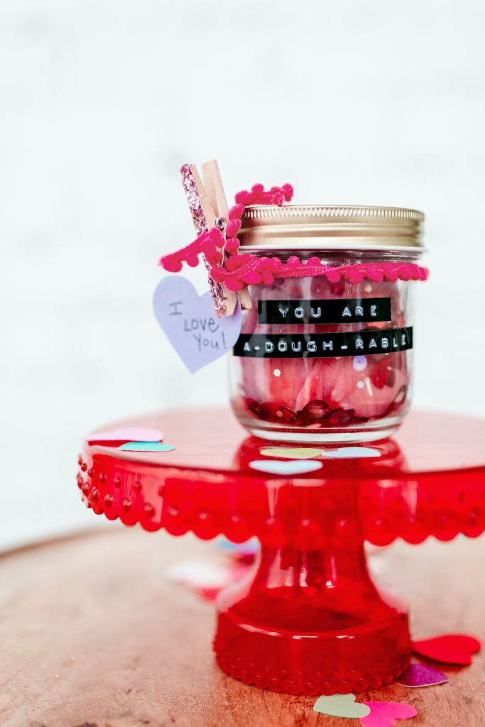 Simple Valentine's Day gift idea for kids: a homemade playdough Valentine. Recipe included