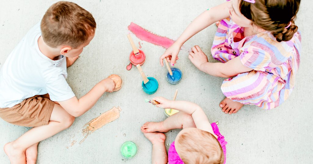 DIY sidewalk chalk paint is an outdoor art activity for all ages! Find out how to make it here!