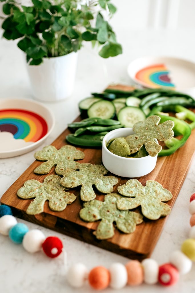 Serve green food for St. Patrick's Day! Make a green snack board with homemade shamrock tortilla chips (click through for recipe!) 