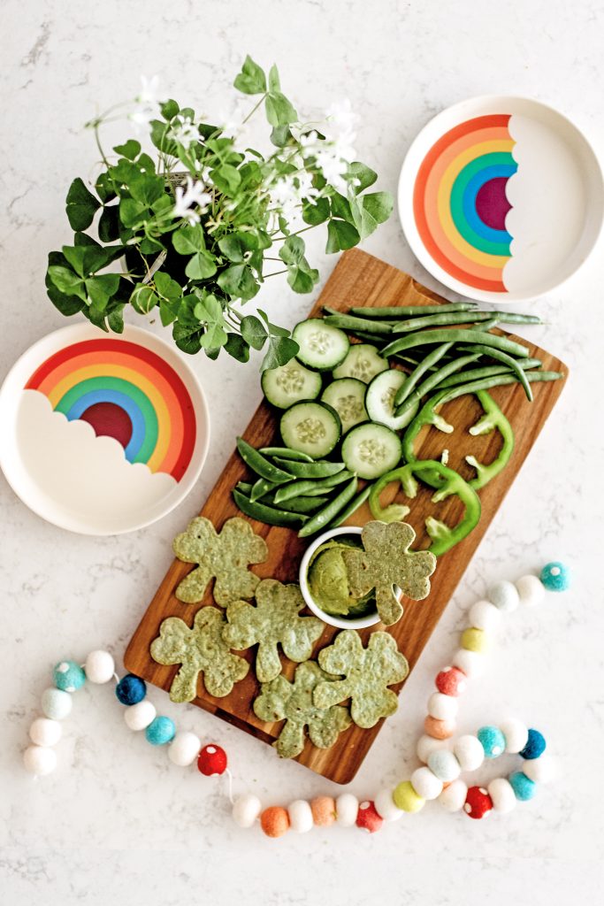 Make a festive and healthy snack board of green food for St Patrick's Day! Check out this easy recipe to DIY green shamrock tortilla chips