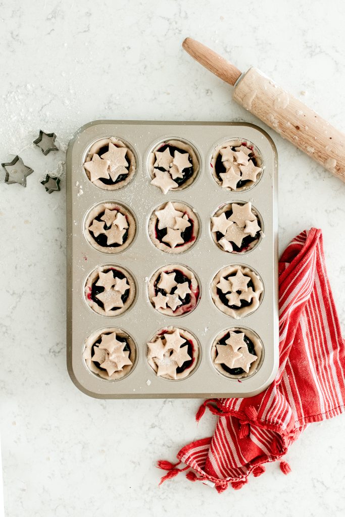 Make mini blueberry pies using a muffin tin! Adorable and easy to bake treat! 
