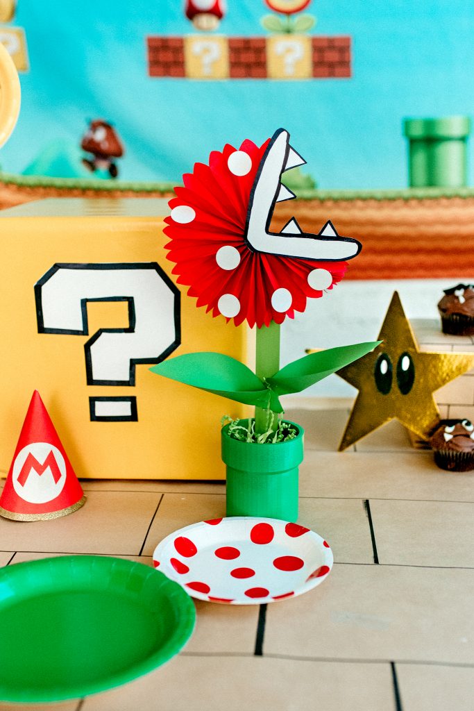 DIY Mario Birthday Party decor! Make a DIY Piranha Plant decoration using pvc pipe and a party fan. 