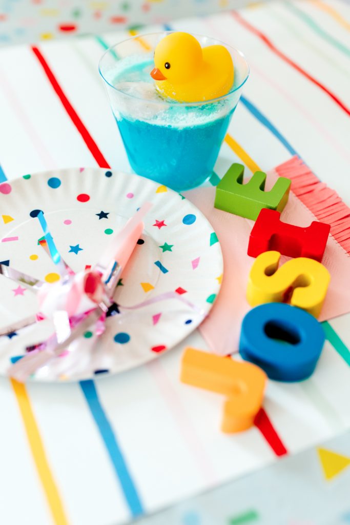 Ernie's Rubber Ducky blue drink and table setting for a Sesame Street birthday. 